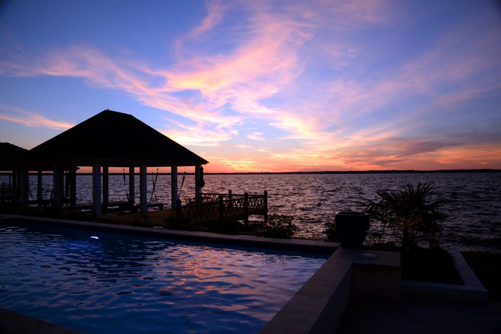 Hot tub - mid-sized transitional backyard stone and custom-shaped lap hot tub idea in Jackson