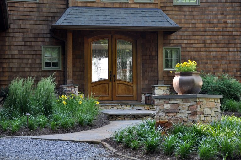 Huge arts and crafts stone front porch idea in DC Metro with a roof extension by McHale Landscape Design, Inc. | Outdoor Photos | Porch | Landscaping | Landscape Design | Outdoor Living Space | Porch Design Ideas | Outdoor Living Space Ideas | Backyard Design