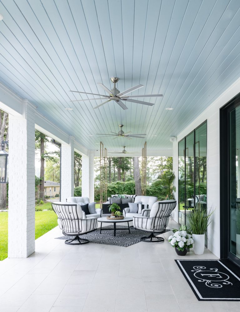 Huge beach style stone back porch idea in Dallas with a fireplace and a roof extension by BGI Design | Outdoor Photos | Porch | Landscaping | Landscape Design | Outdoor Living Space | Porch Design Ideas | Outdoor Living Space Ideas | Backyard Design