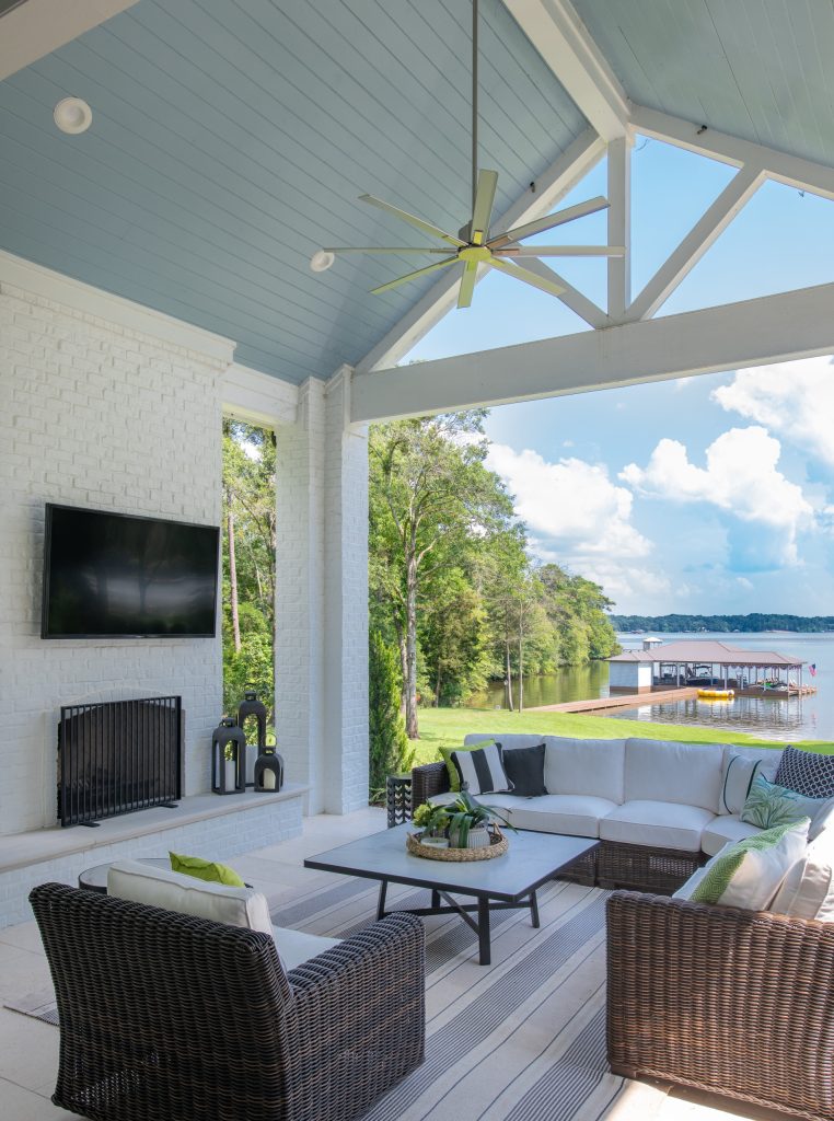 Huge beach style stone back porch photo in Dallas with a fireplace and a roof extension by BGI Design | Outdoor Photos | Porch | Landscaping | Landscape Design | Outdoor Living Space | Porch Design Ideas | Outdoor Living Space Ideas | Backyard Design