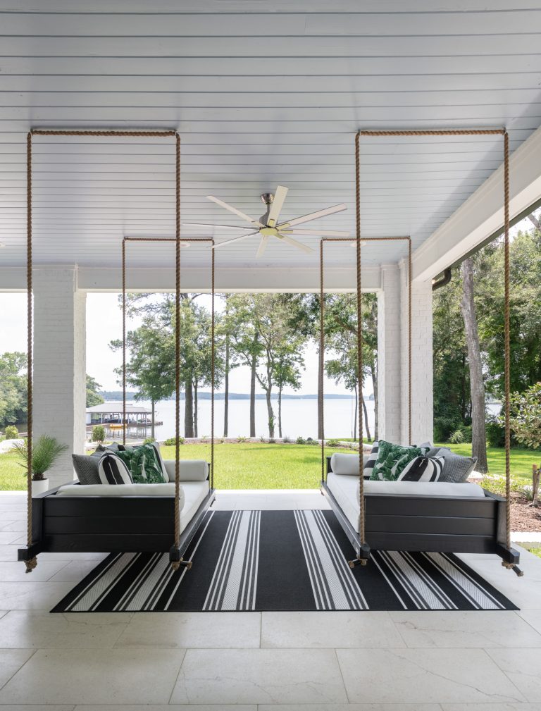 Huge beach style stone back porch photo in Dallas with a roof extension by BGI Design | Outdoor Photos | Porch | Landscaping | Landscape Design | Outdoor Living Space | Porch Design Ideas | Outdoor Living Space Ideas | Backyard Design