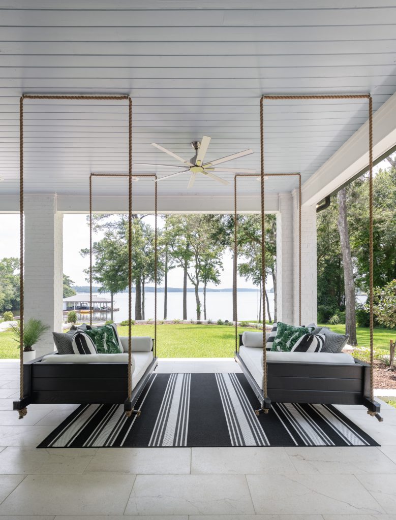 Huge beach style stone back porch photo in Dallas with a roof extension by BGI Design | Outdoor Photos | Porch | Landscaping | Landscape Design | Outdoor Living Space | Porch Design Ideas | Outdoor Living Space Ideas | Backyard Design