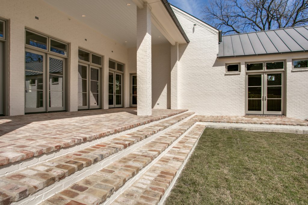 Huge classic brick back porch idea in Dallas with a roof extension by TODD JAMES HOMES | Outdoor Photos | Porch | Landscaping | Landscape Design | Outdoor Living Space | Porch Design Ideas | Outdoor Living Space Ideas | Backyard Design