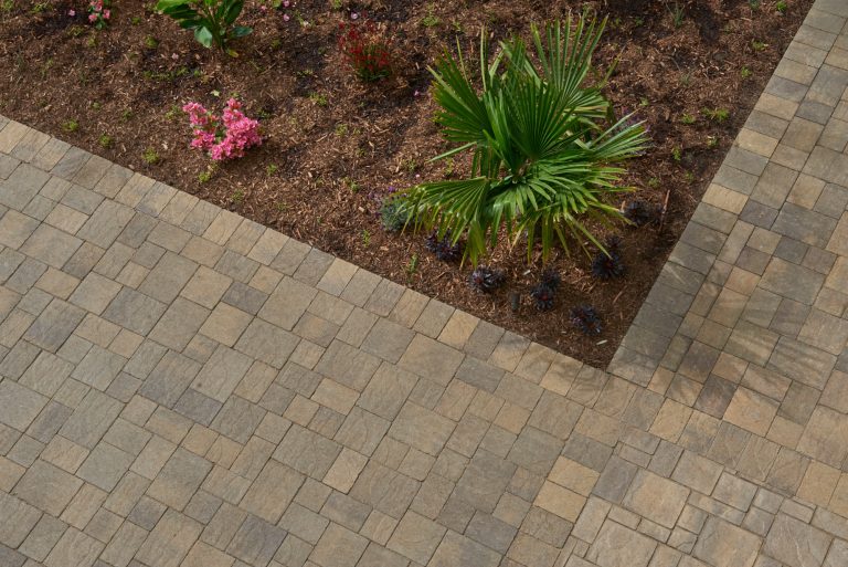 Huge island style backyard brick patio kitchen photo in Los Angeles with no cover