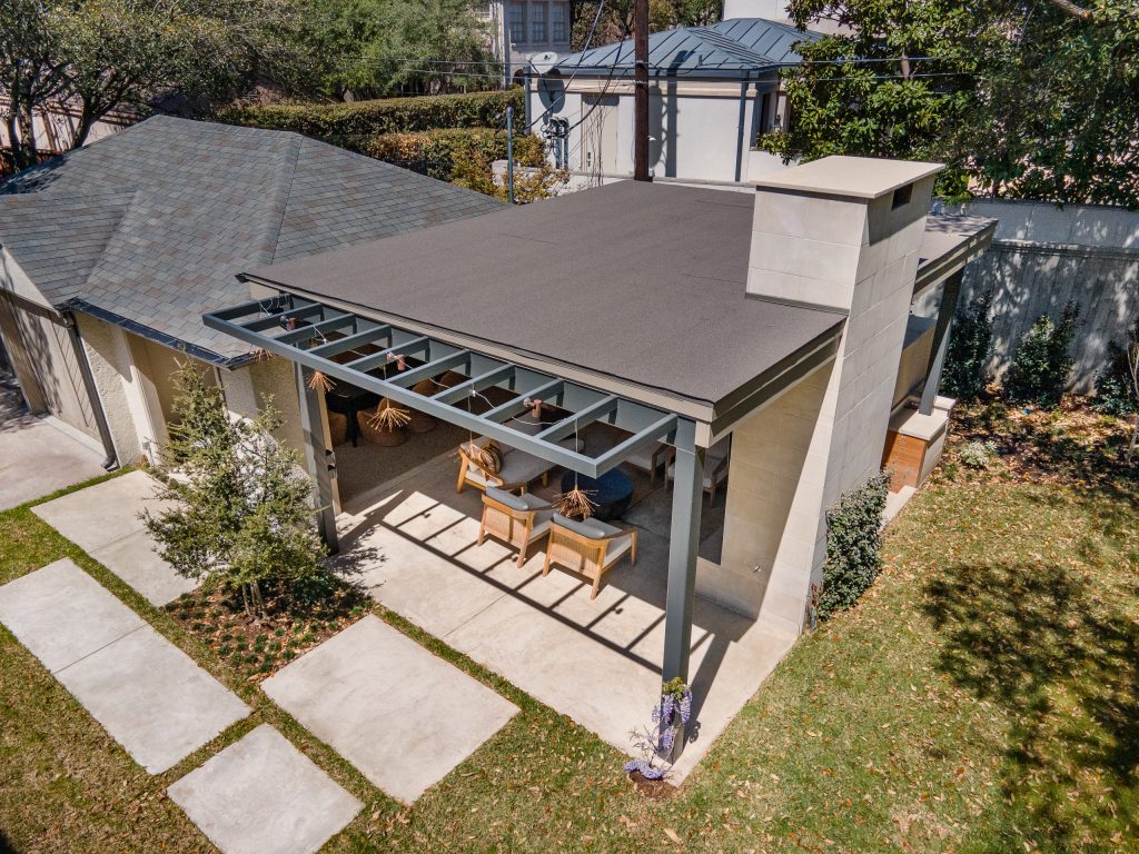 Huge minimalist backyard concrete patio kitchen photo in Dallas with a gazebo