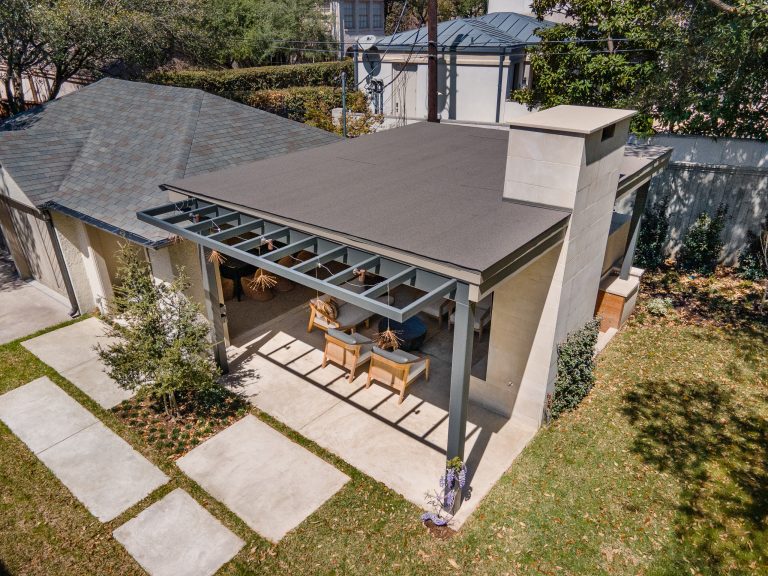 Huge minimalist backyard concrete patio kitchen photo in Dallas with a gazebo