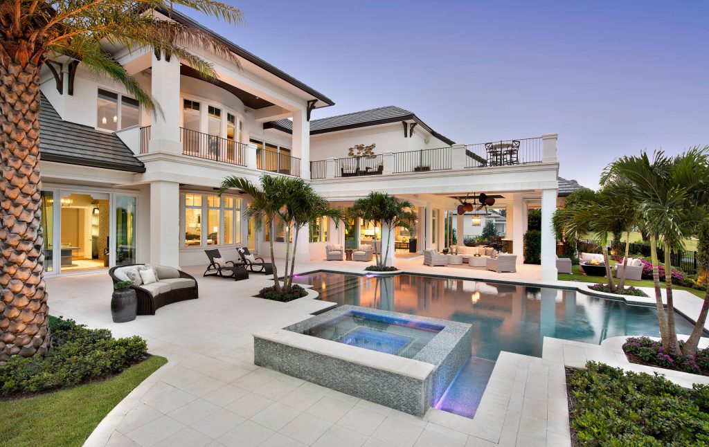 Huge transitional backyard custom-shaped hot tub photo in Miami