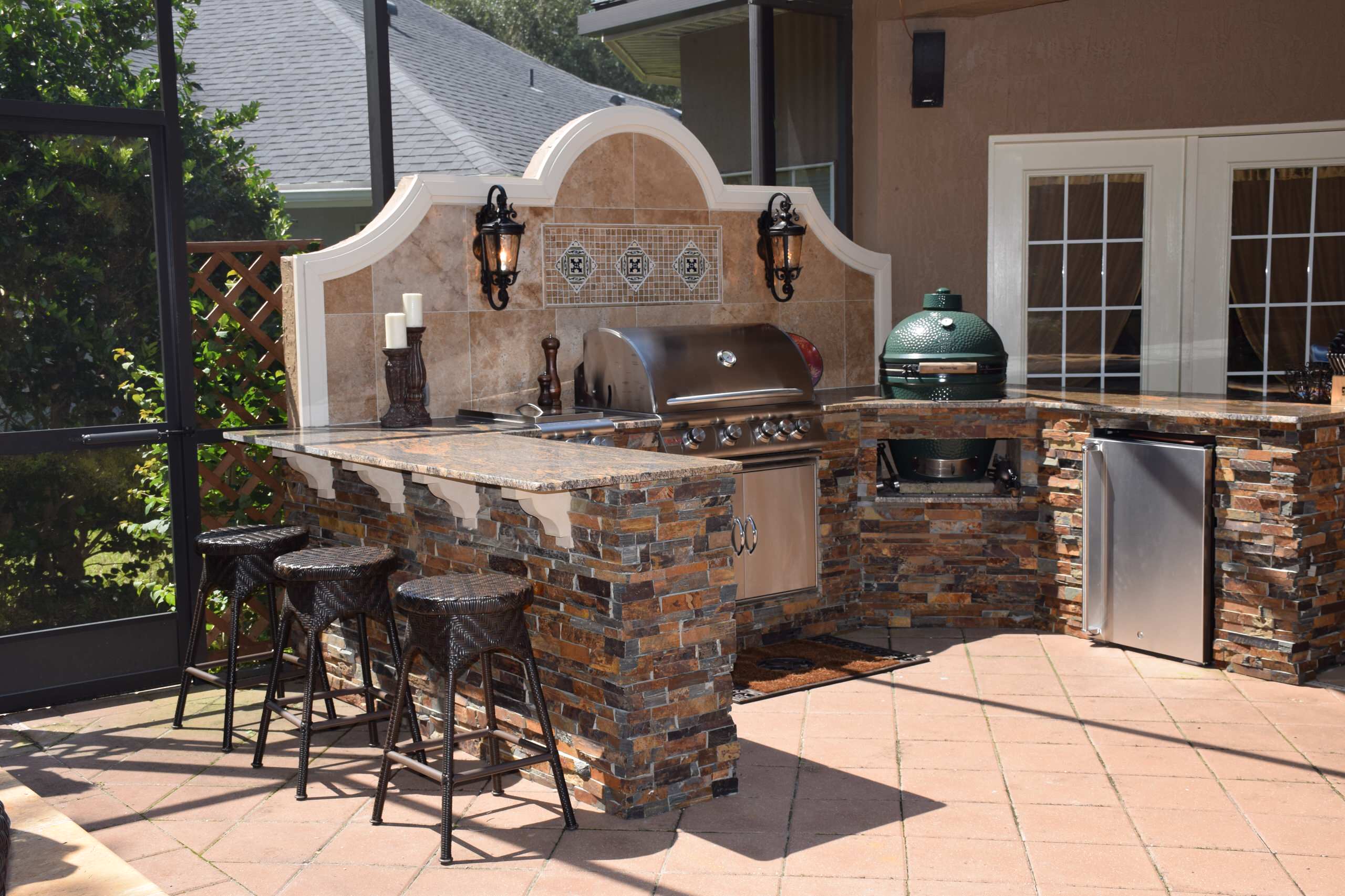 Huge transitional backyard tile patio kitchen photo in Jacksonville