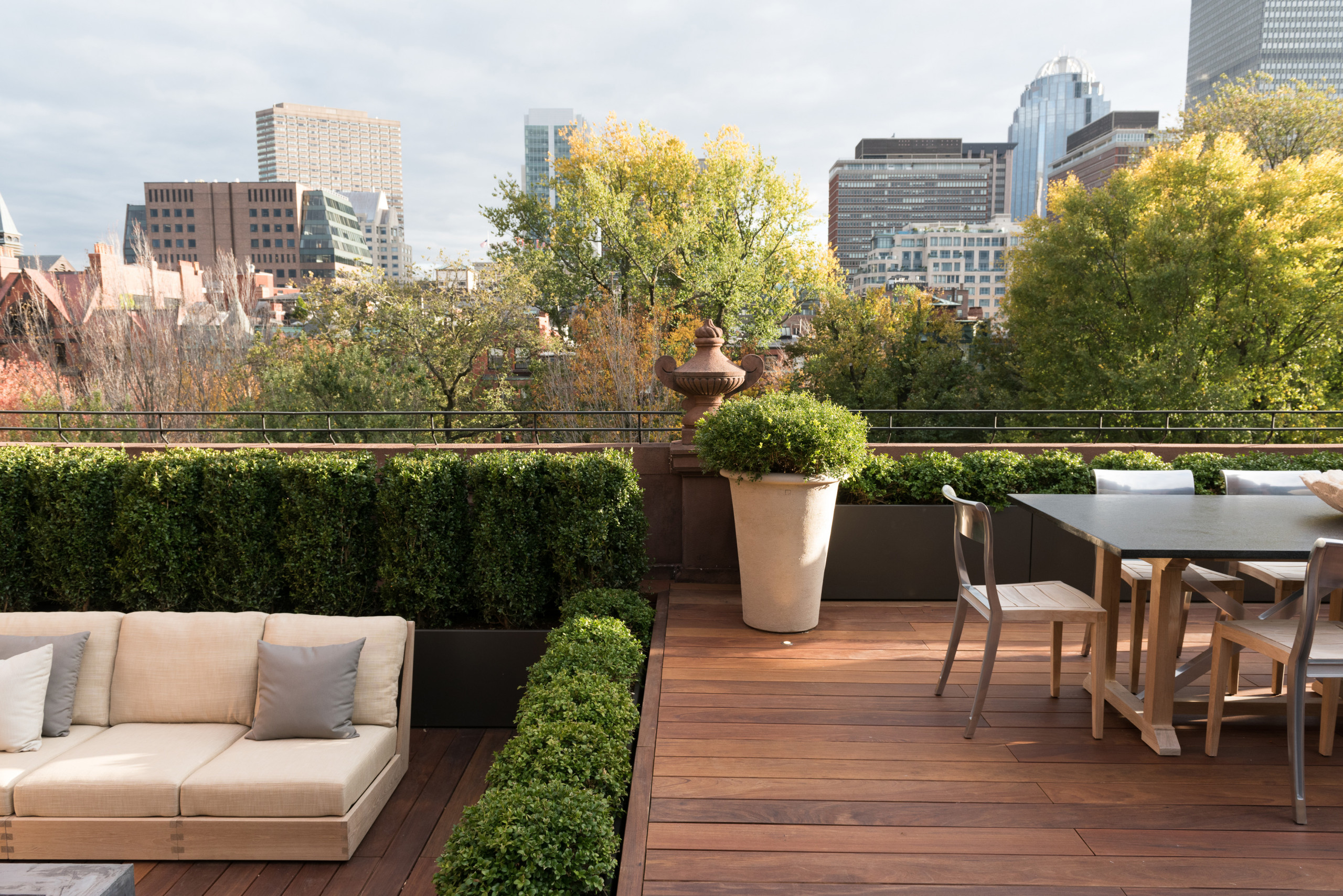 Huge trendy rooftop outdoor kitchen deck photo in Boston with no cover