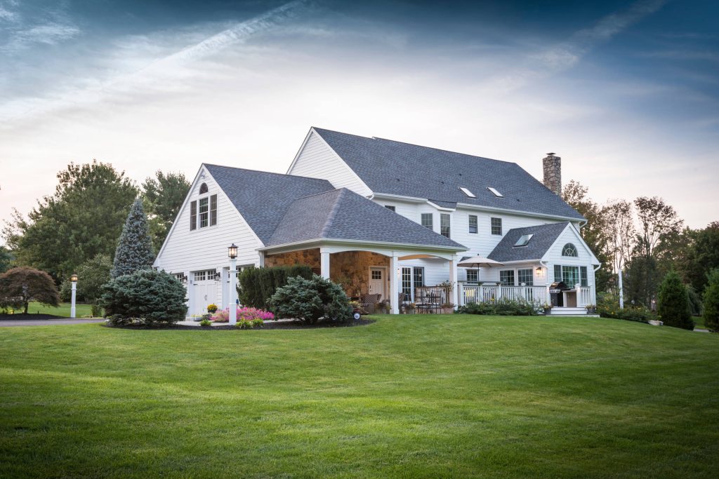 Huge trendy stone back porch idea in Philadelphia with a roof extension by Chestnut Hill Landscape Contractors | Outdoor Photos | Porch | Landscaping | Landscape Design | Outdoor Living Space | Porch Design Ideas | Outdoor Living Space Ideas | Backyard Design