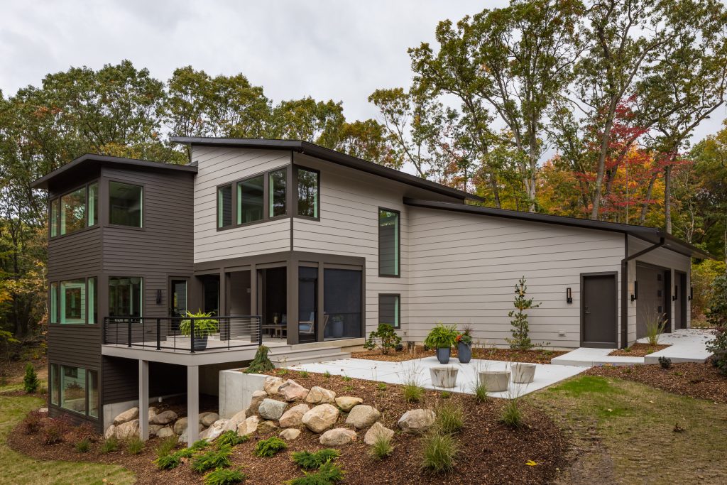 Incredible outdoor living space in this home. Screen porch has retractable screens that open to a beautiful deck which is attached to a welcoming patio. by Bruce Heys Builders | Outdoor Photos | Porch | Landscaping | Landscape Design | Outdoor Living Space | Porch Design Ideas | Outdoor Living Space Ideas | Backyard Design