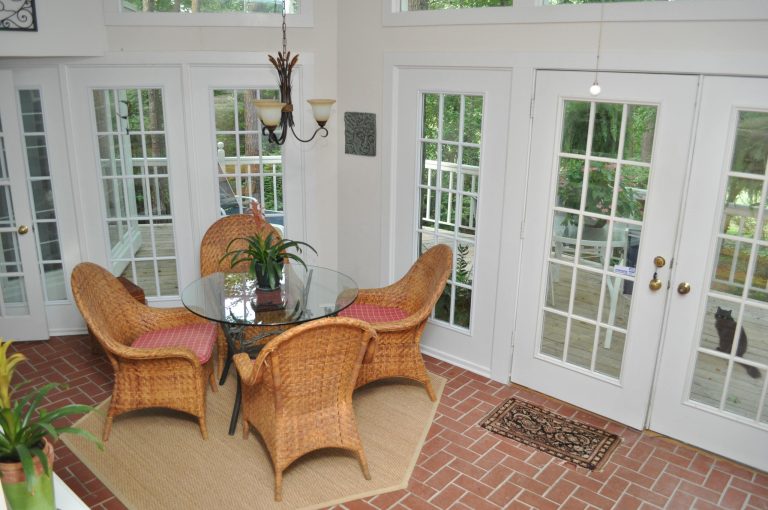 Informal eating area on a sunny porch.