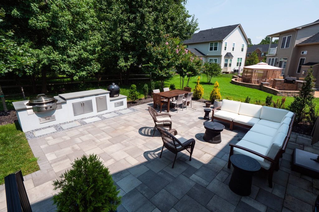 Inspiration for a backyard concrete paver patio kitchen remodel in DC Metro