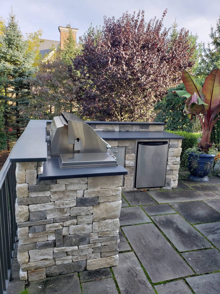 Inspiration for a backyard patio kitchen remodel in New York
