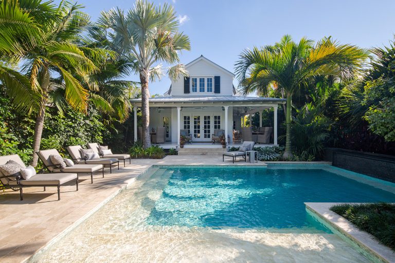 Inspiration for a coastal backyard l-shaped pool house remodel in Miami