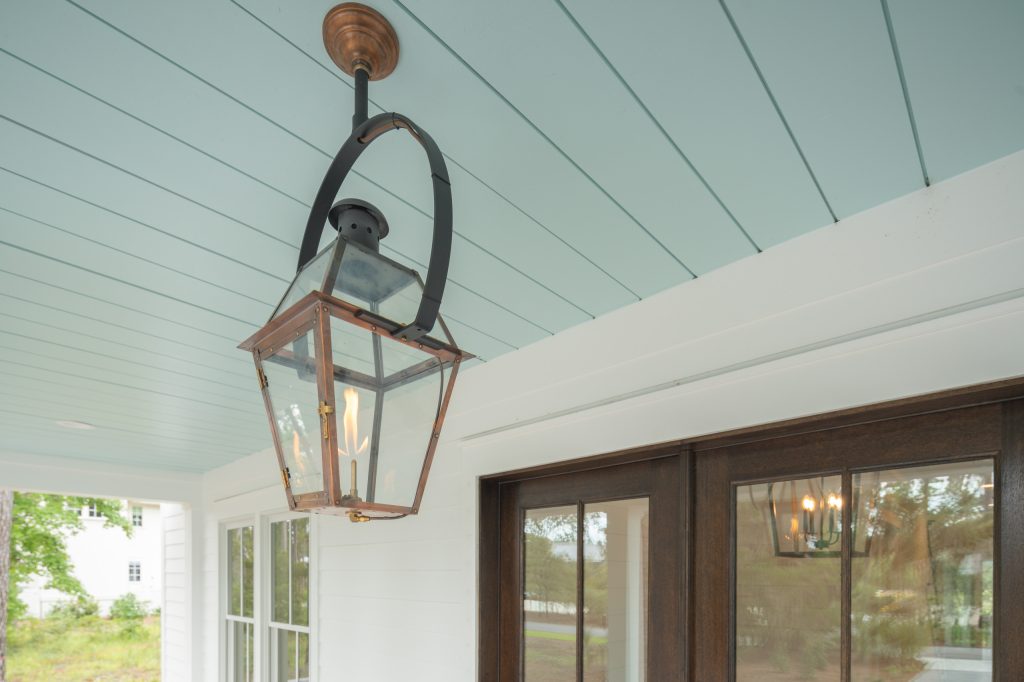 Inspiration for a coastal front porch remodel in Other with a roof extension by Front Light Building Co. | Outdoor Photos | Porch | Landscaping | Landscape Design | Outdoor Living Space | Porch Design Ideas | Outdoor Living Space Ideas | Backyard Design