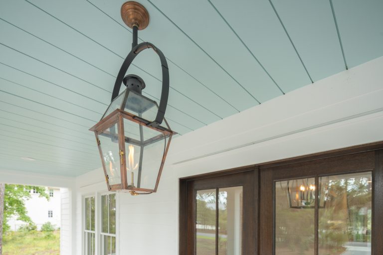 Inspiration for a coastal front porch remodel in Other with a roof extension by Front Light Building Co. | Outdoor Photos | Porch | Landscaping | Landscape Design | Outdoor Living Space | Porch Design Ideas | Outdoor Living Space Ideas | Backyard Design