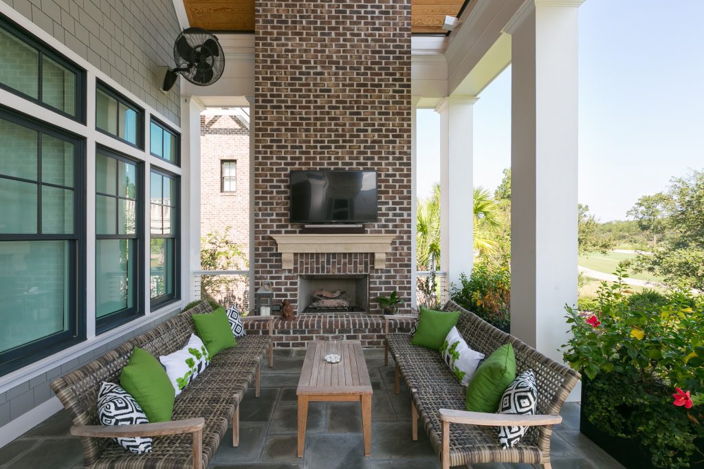 Inspiration for a coastal porch remodel in Charleston with a fireplace and a roof extension by Translations Design Studio, LLC | Outdoor Photos | Porch | Landscaping | Landscape Design | Outdoor Living Space | Porch Design Ideas | Outdoor Living Space Ideas | Backyard Design