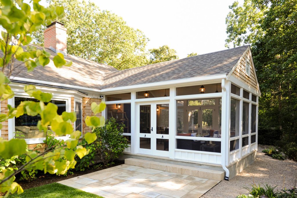 Inspiration for a coastal stone screened-in back porch remodel in Boston with a roof extension by Salt Architecture Inc. | Outdoor Photos | Porch | Landscaping | Landscape Design | Outdoor Living Space | Porch Design Ideas | Outdoor Living Space Ideas | Backyard Design