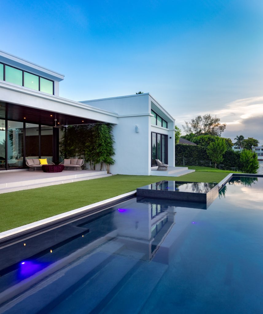 Inspiration for a contemporary backyard custom-shaped lap hot tub remodel in Miami