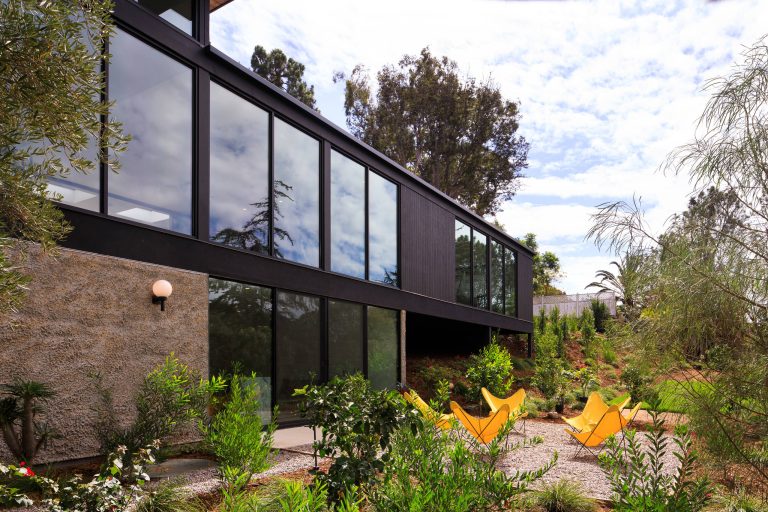 Inspiration for a contemporary backyard gravel landscaping in San Diego.