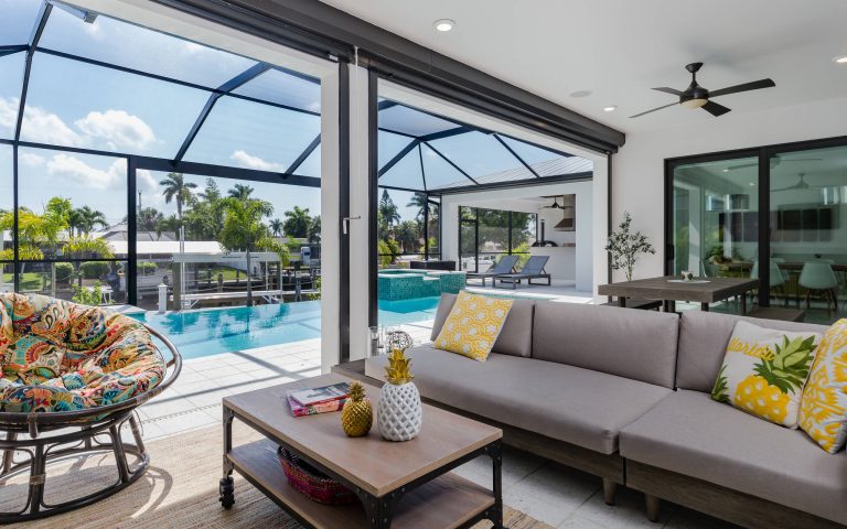 Inspiration for a contemporary backyard patio kitchen remodel in Miami with a roof extension