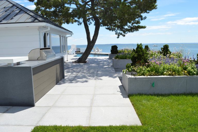 Inspiration for a contemporary backyard patio kitchen remodel in New York with no cover