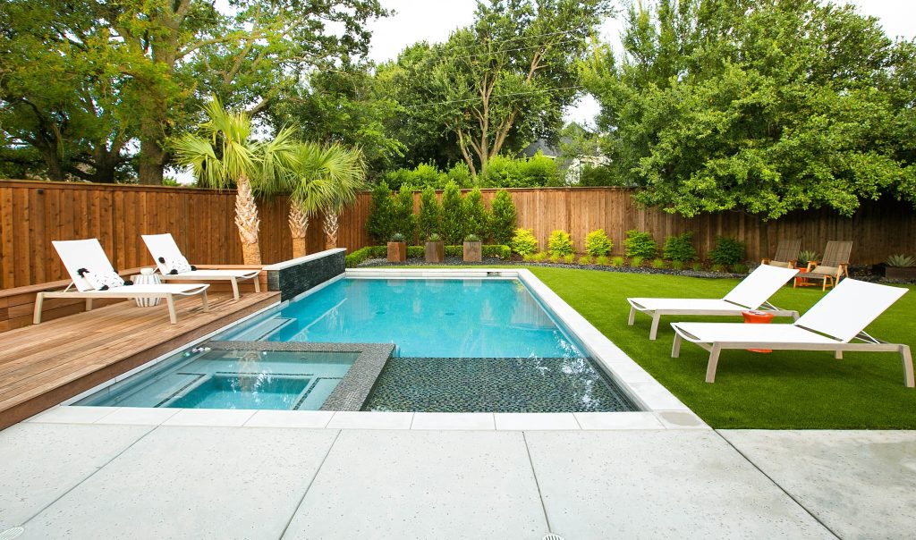 Inspiration for a contemporary backyard rectangular hot tub remodel in Dallas