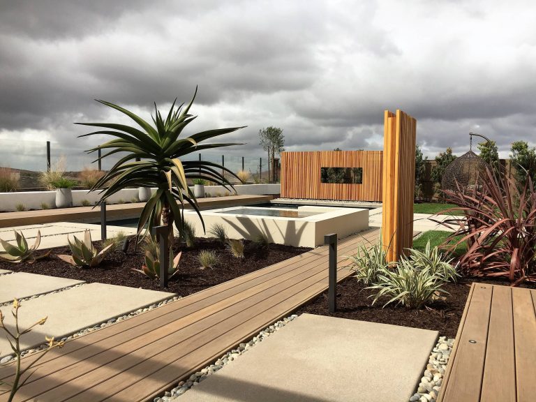 Inspiration for a contemporary backyard rectangular pool remodel in San Diego with decking