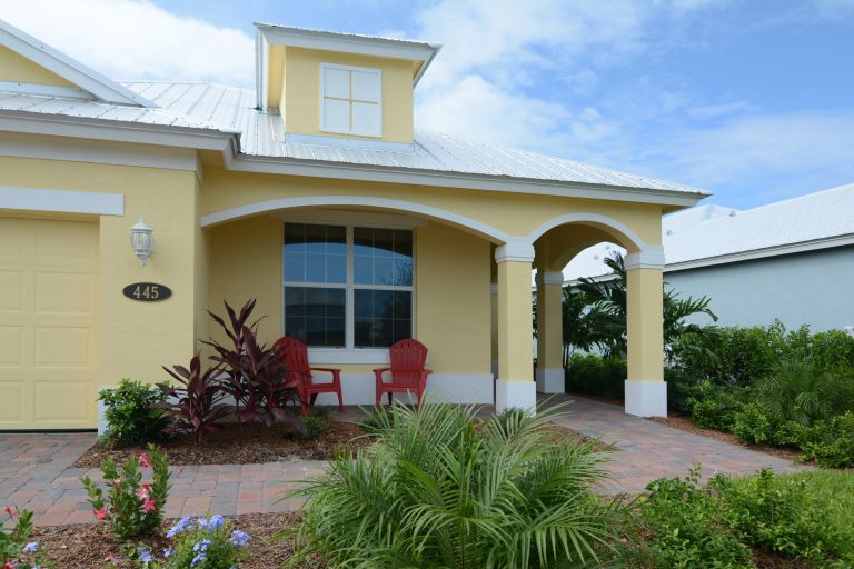 Inspiration for a contemporary brick front porch remodel in Miami with a roof extension by GHO Homes | Outdoor Photos | Porch | Landscaping | Landscape Design | Outdoor Living Space | Porch Design Ideas | Outdoor Living Space Ideas | Backyard Design