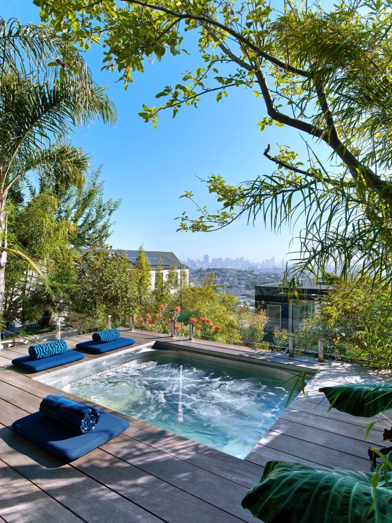 Inspiration for a contemporary rectangular hot tub remodel in San Francisco with decking
