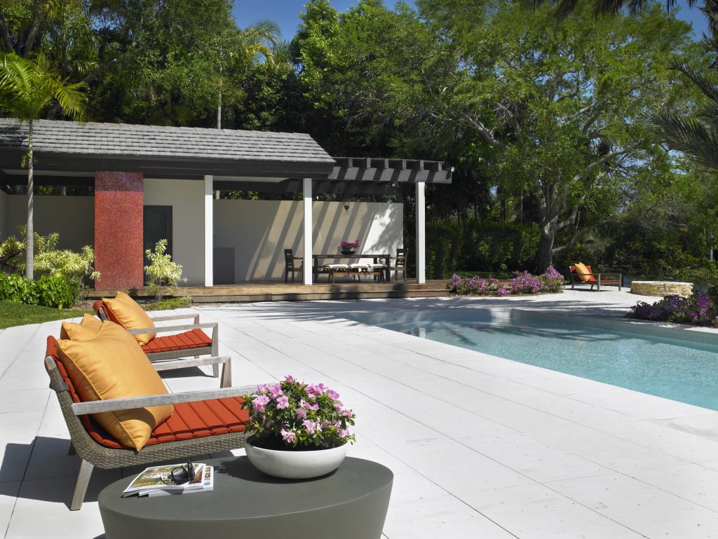 Inspiration for a contemporary stamped concrete and rectangular pool remodel in Miami