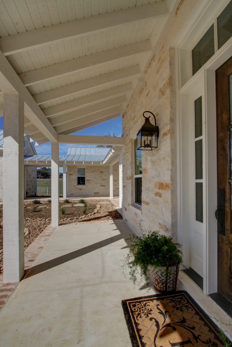 Inspiration for a cottage concrete front porch remodel in Austin with a roof extension by Parker Homes | Outdoor Photos | Porch | Landscaping | Landscape Design | Outdoor Living Space | Porch Design Ideas | Outdoor Living Space Ideas | Backyard Design