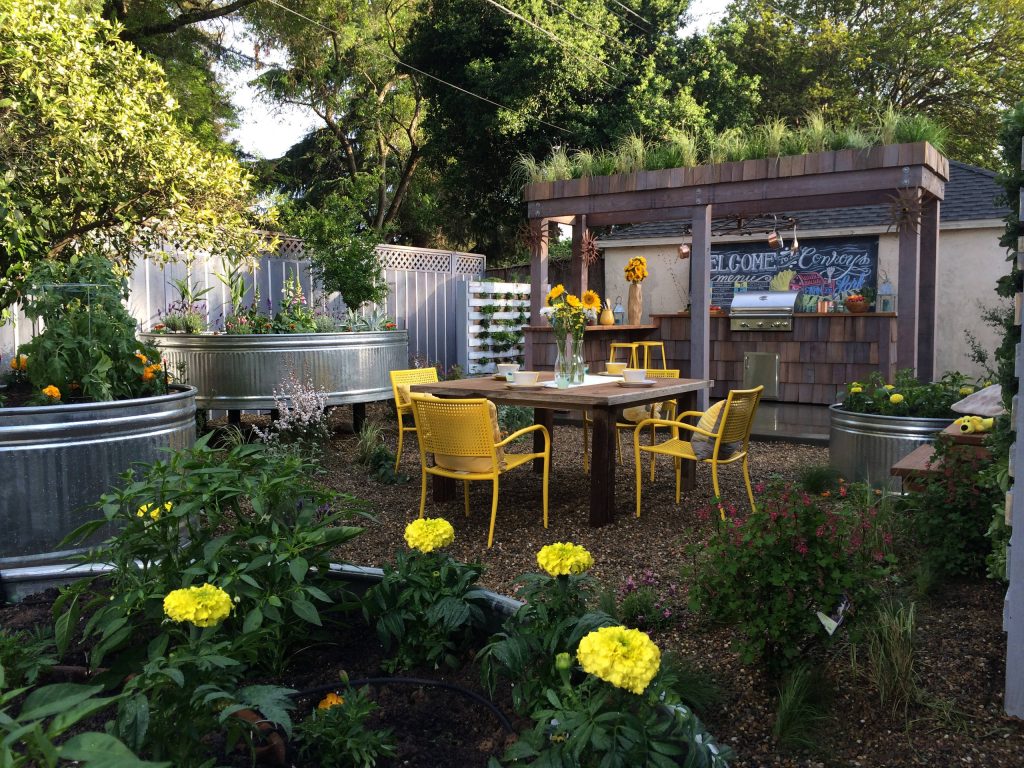Inspiration for a country backyard patio kitchen remodel in Other with no cover