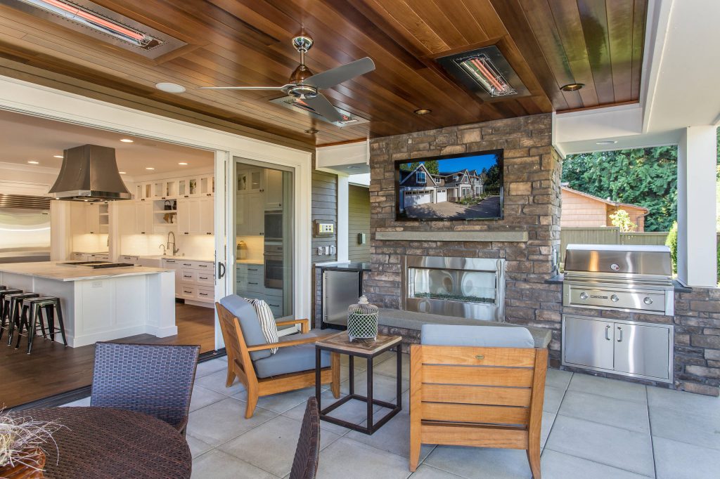 Inspiration for a craftsman concrete paver back porch remodel in Seattle with a roof extension by BDR Fine Homes | Outdoor Photos | Porch | Landscaping | Landscape Design | Outdoor Living Space | Porch Design Ideas | Outdoor Living Space Ideas | Backyard Design