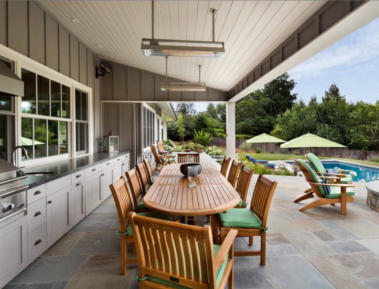 Inspiration for a farmhouse backyard stone patio kitchen remodel in San Francisco with a roof extension