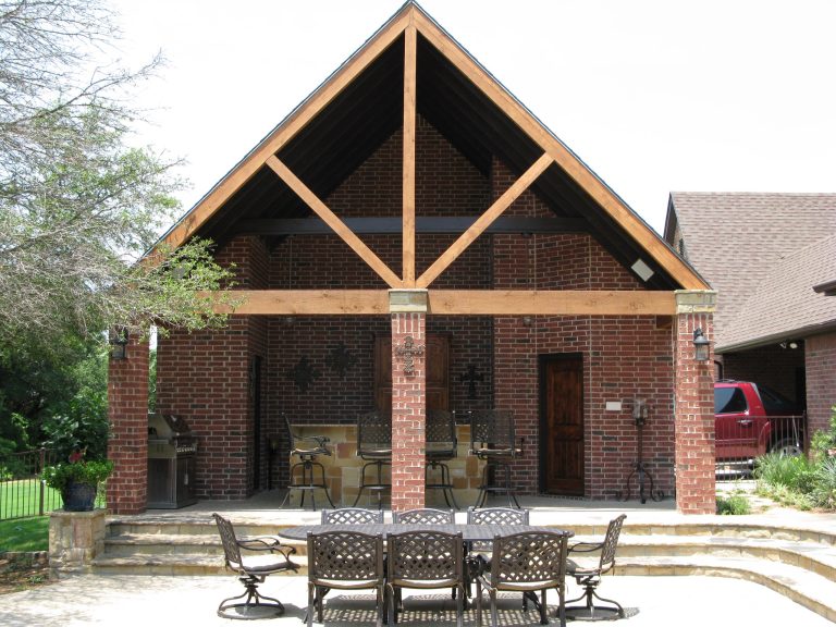 Inspiration for a farmhouse brick patio kitchen remodel in Dallas with an awning