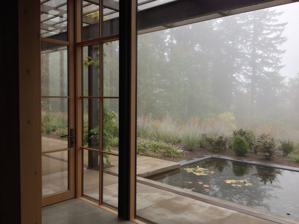 Inspiration for a farmhouse concrete back porch remodel in Portland with a pergola by Otis Construction Inc. | Outdoor Photos | Porch | Landscaping | Landscape Design | Outdoor Living Space | Porch Design Ideas | Outdoor Living Space Ideas | Backyard Design