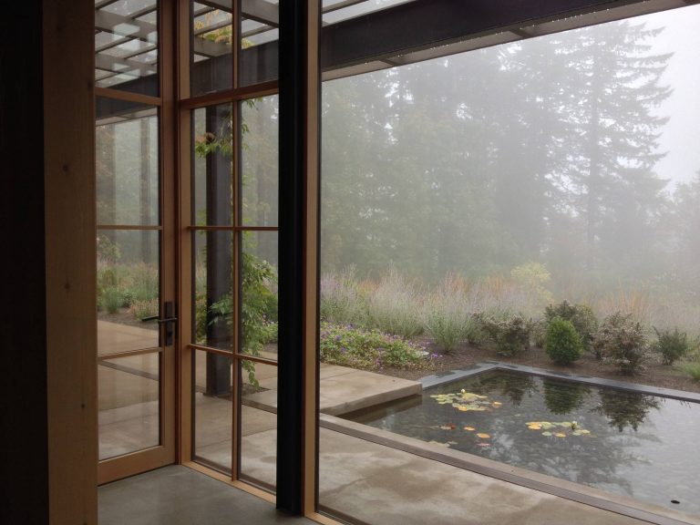 Inspiration for a farmhouse concrete back porch remodel in Portland with a pergola by Otis Construction Inc. | Outdoor Photos | Porch | Landscaping | Landscape Design | Outdoor Living Space | Porch Design Ideas | Outdoor Living Space Ideas | Backyard Design