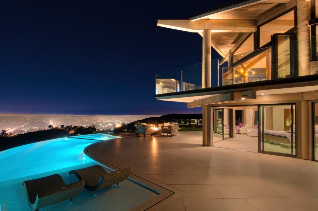 Inspiration for a huge contemporary backyard concrete patio kitchen remodel in Los Angeles with no cover