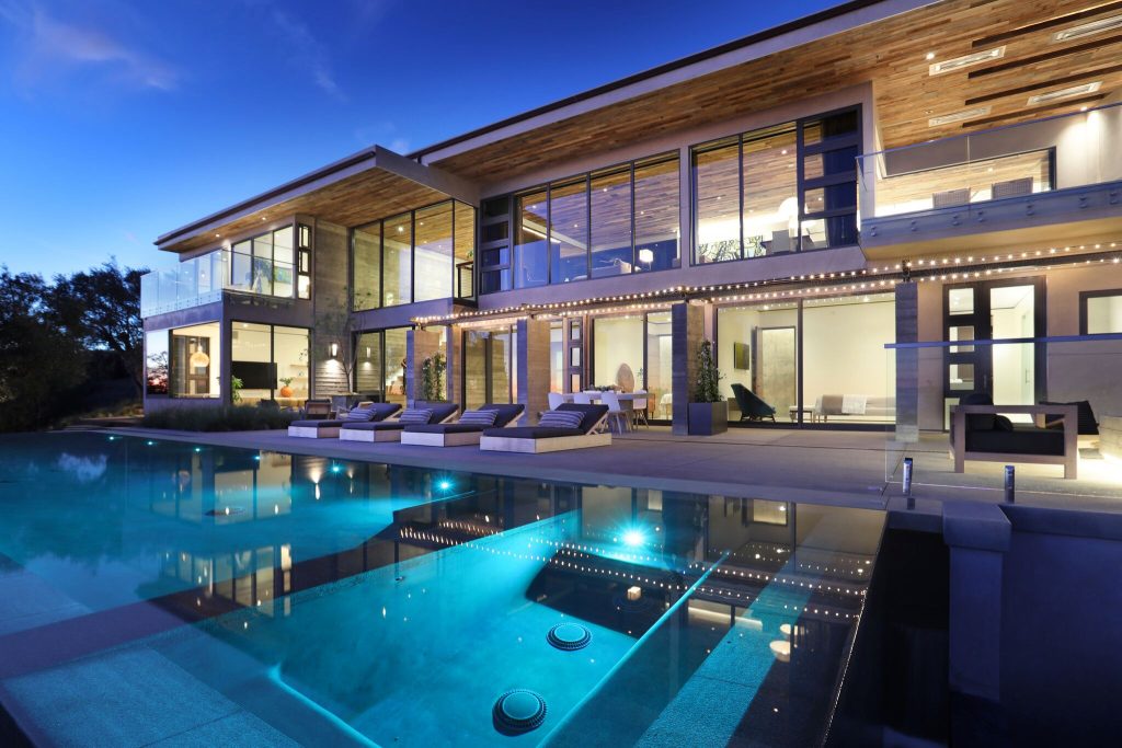 Inspiration for a huge contemporary backyard concrete paver patio kitchen remodel in Orange County with no cover