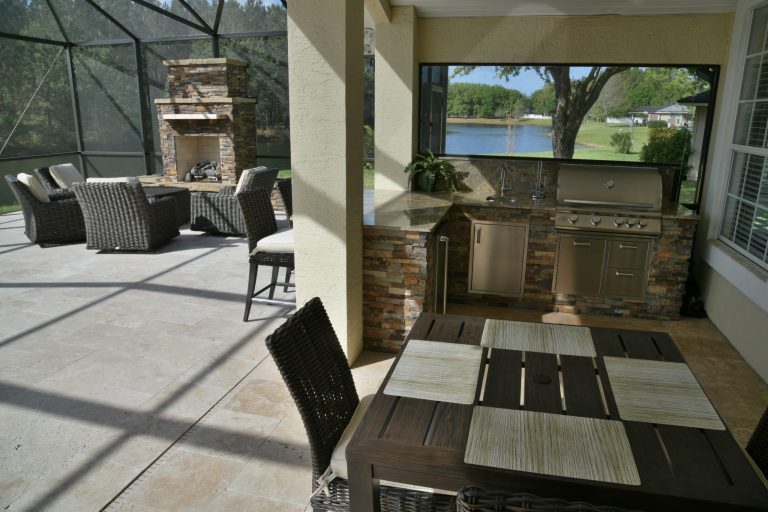 Inspiration for a huge contemporary backyard tile patio kitchen remodel in Jacksonville
