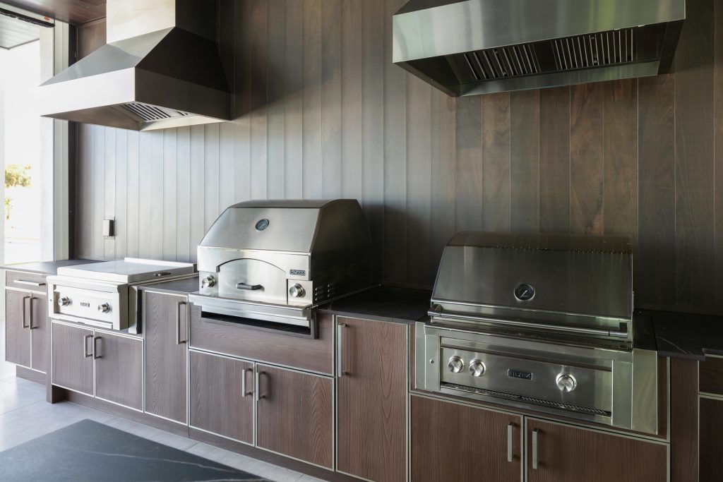 Inspiration for a huge contemporary courtyard tile patio kitchen remodel in Tampa with a roof extension
