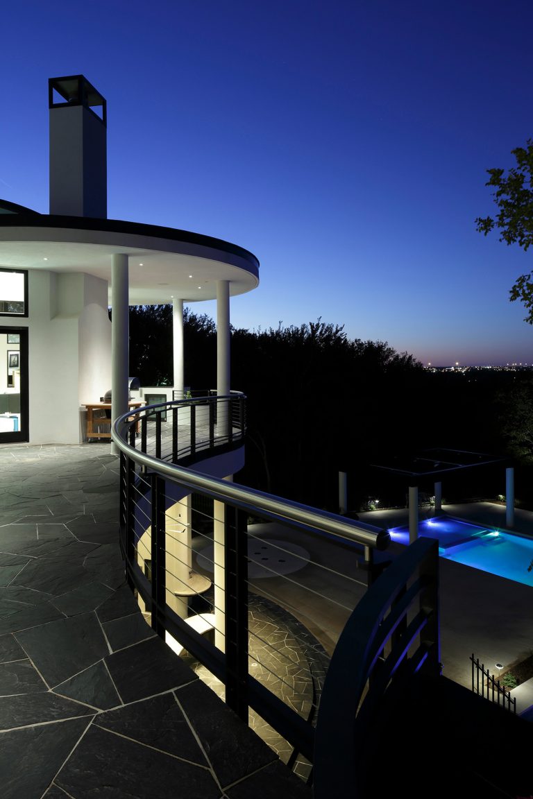 Inspiration for a huge contemporary stone back porch remodel in Dallas with a roof extension by DW Distinctive Properties | Outdoor Photos | Porch | Landscaping | Landscape Design | Outdoor Living Space | Porch Design Ideas | Outdoor Living Space Ideas | Backyard Design