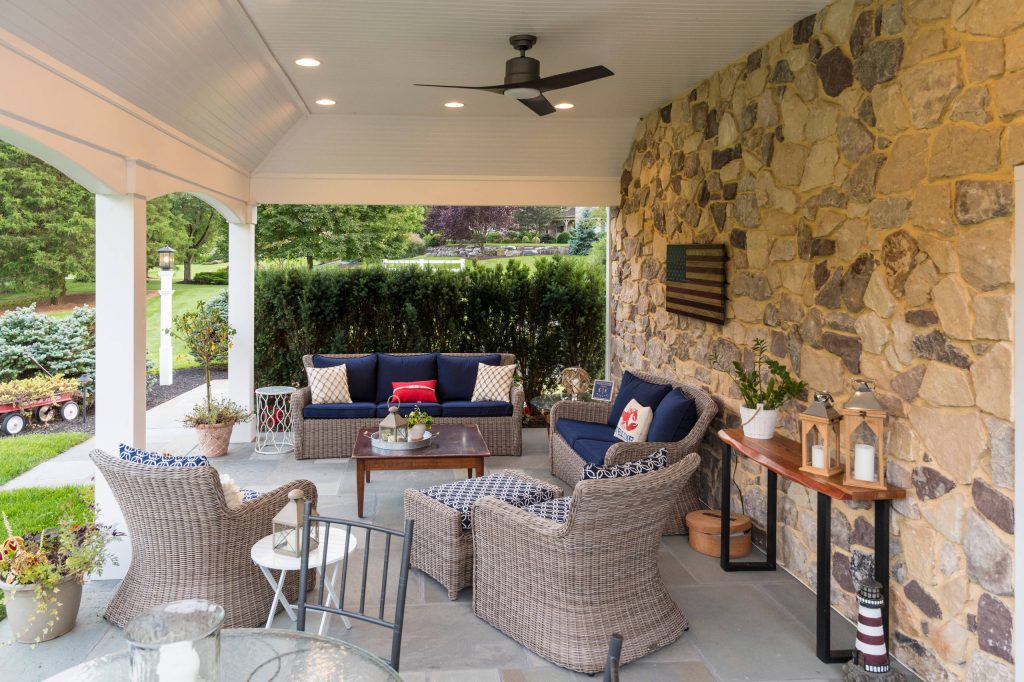 Inspiration for a huge contemporary stone back porch remodel in Philadelphia with a roof extension by Chestnut Hill Landscape Contractors | Outdoor Photos | Porch | Landscaping | Landscape Design | Outdoor Living Space | Porch Design Ideas | Outdoor Living Space Ideas | Backyard Design