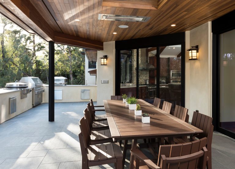 Inspiration for a huge modern backyard tile patio kitchen remodel in San Diego with a roof extension
