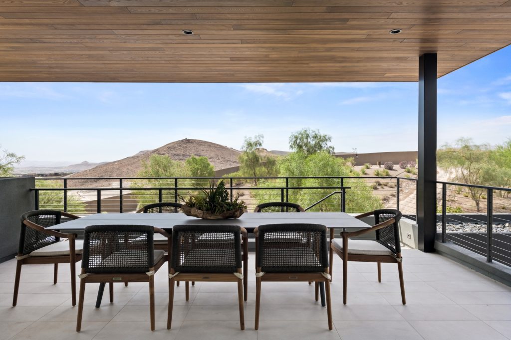 Inspiration for a huge modern patio kitchen remodel in Las Vegas with a roof extension
