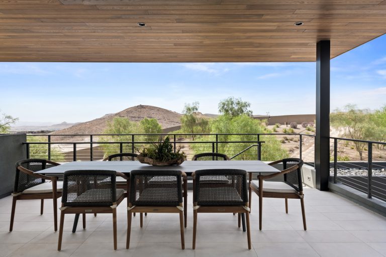 Inspiration for a huge modern patio kitchen remodel in Las Vegas with a roof extension