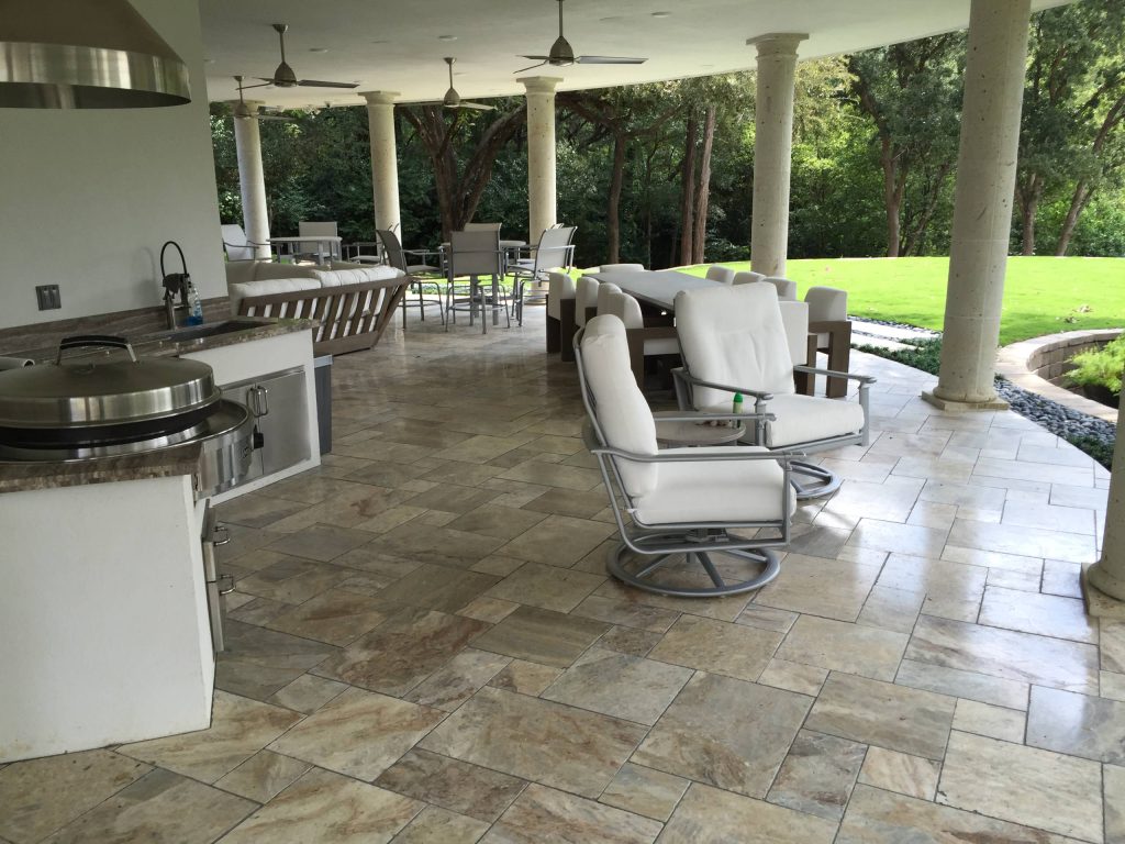 Inspiration for a huge timeless backyard concrete paver patio kitchen remodel in Austin with a roof extension