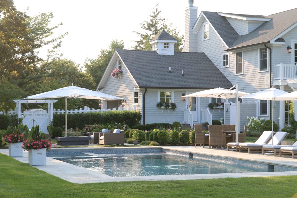 Inspiration for a huge timeless backyard stone and rectangular lap hot tub remodel in New York